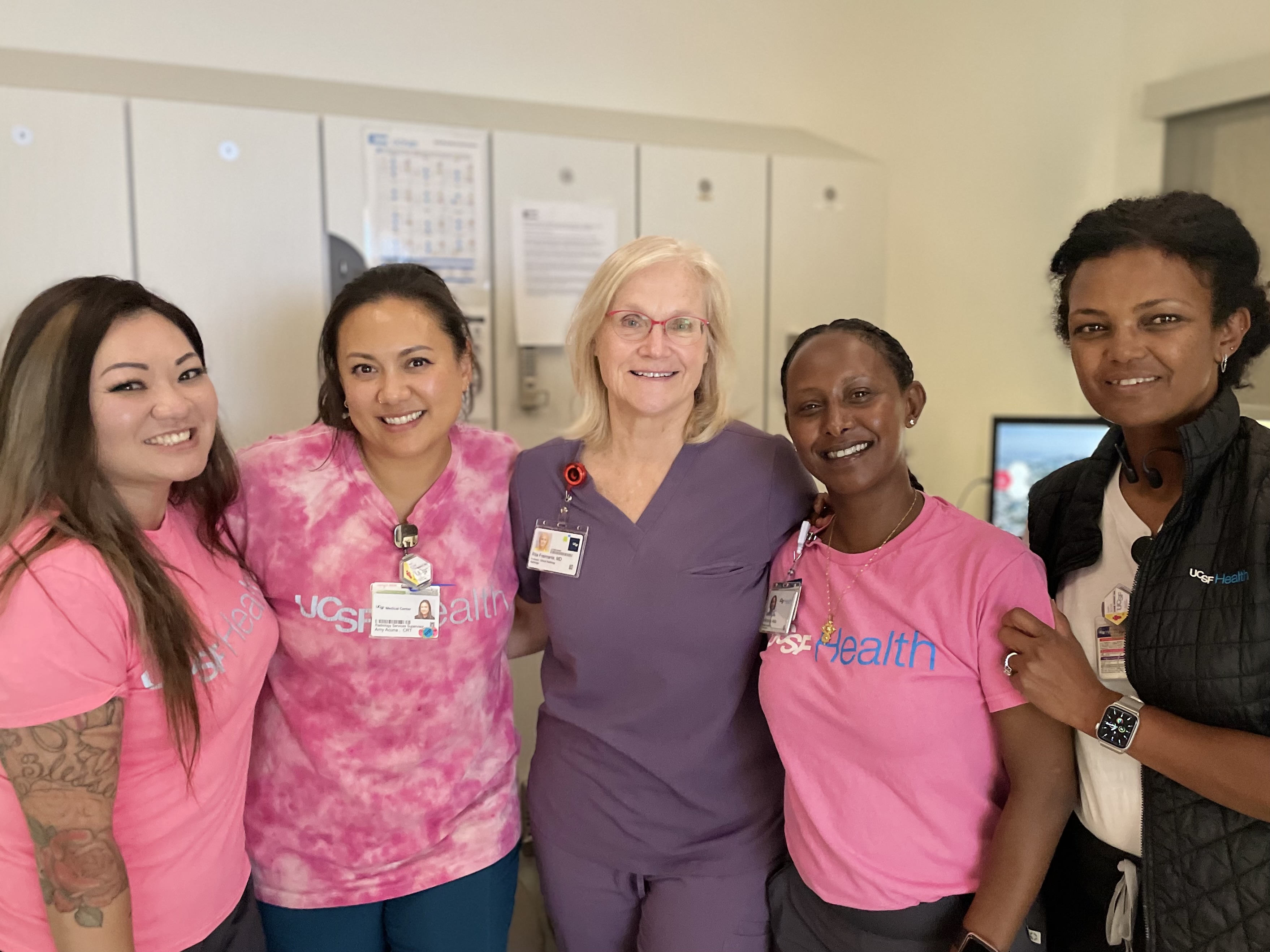 Theresa Yu, MD, Resident, Amy Acuna, Radiology Services Supervisor, CRT, Rita Freimanis, MD, Professor, Wintana Aklilu, Medical Assistant, Mammography, Saba Beiene, Senior Radiologic Technologist. A group of women standing together shoulder-to-shoulder smiling.