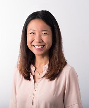 Headshot of Hailey Choi, MD, who is wearing a pink shirt on a light-colored background.