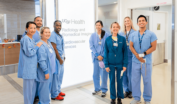 A group of radiologic technologists wearing scrubs at UCSF Radiology Cardiovascular Services.