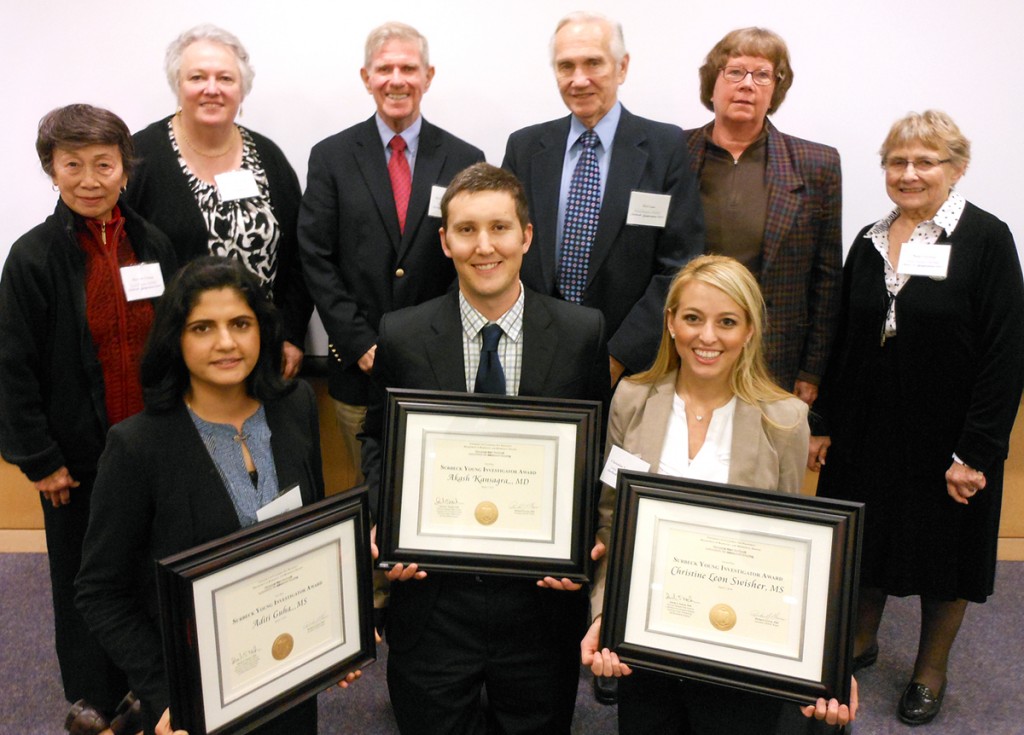 Front Row: Aditi Guha, MS (first place), Marc Mabray, MD, accepting award for Akash Kansagra, MD (third place), and Christine Leon Swisher, MS (second place). Back Row: Dr. Sarah Nelson (second from left) with INDNJC board members.