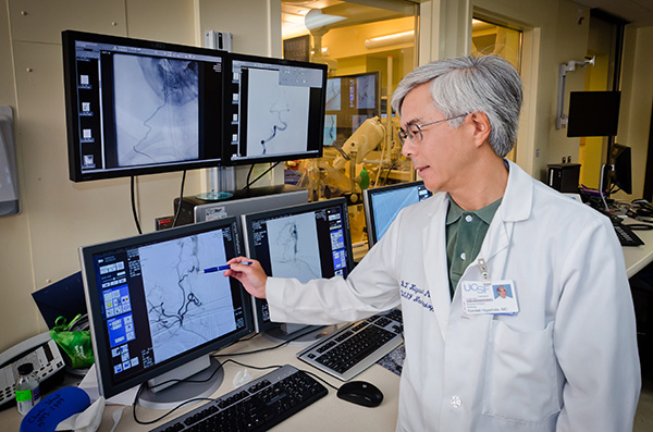 Neuro Interventional Radiology Section Chief Randall Higashida, MD is shown here reviewing angiography images. Catheter directed angiography performed by the Neuro Interventional Radiologists was essential in making the diagnosis of RCVS for this reported case.