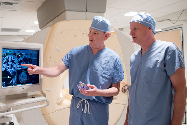 Drs. Paul Larson (left) and Alastair Martin (right) discuss the MRI-guided approach for delivering gene therapy.