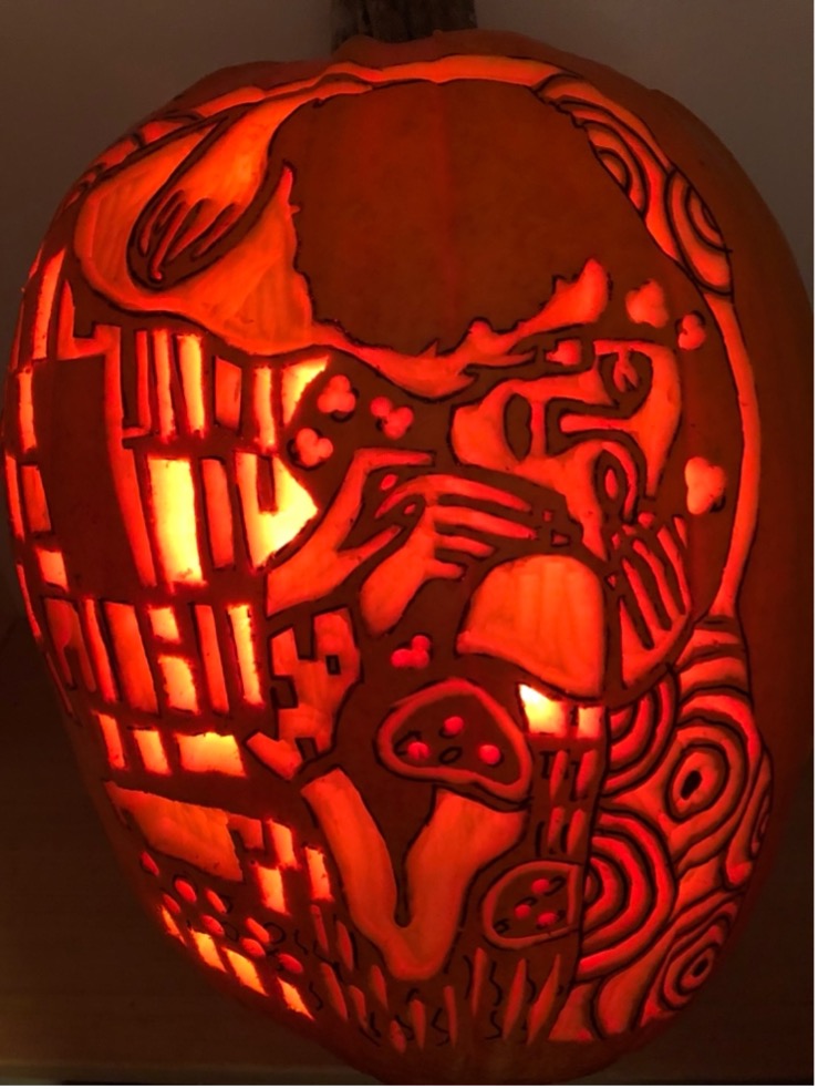 One of Dr. Vella’s intricate carved pumpkins is based on the painting The Kiss by the artist Gustav Klimt. One of Dr. Vella’s intricate carved pumpkins is based on the painting The Kiss by the artist Gustav Klimt.