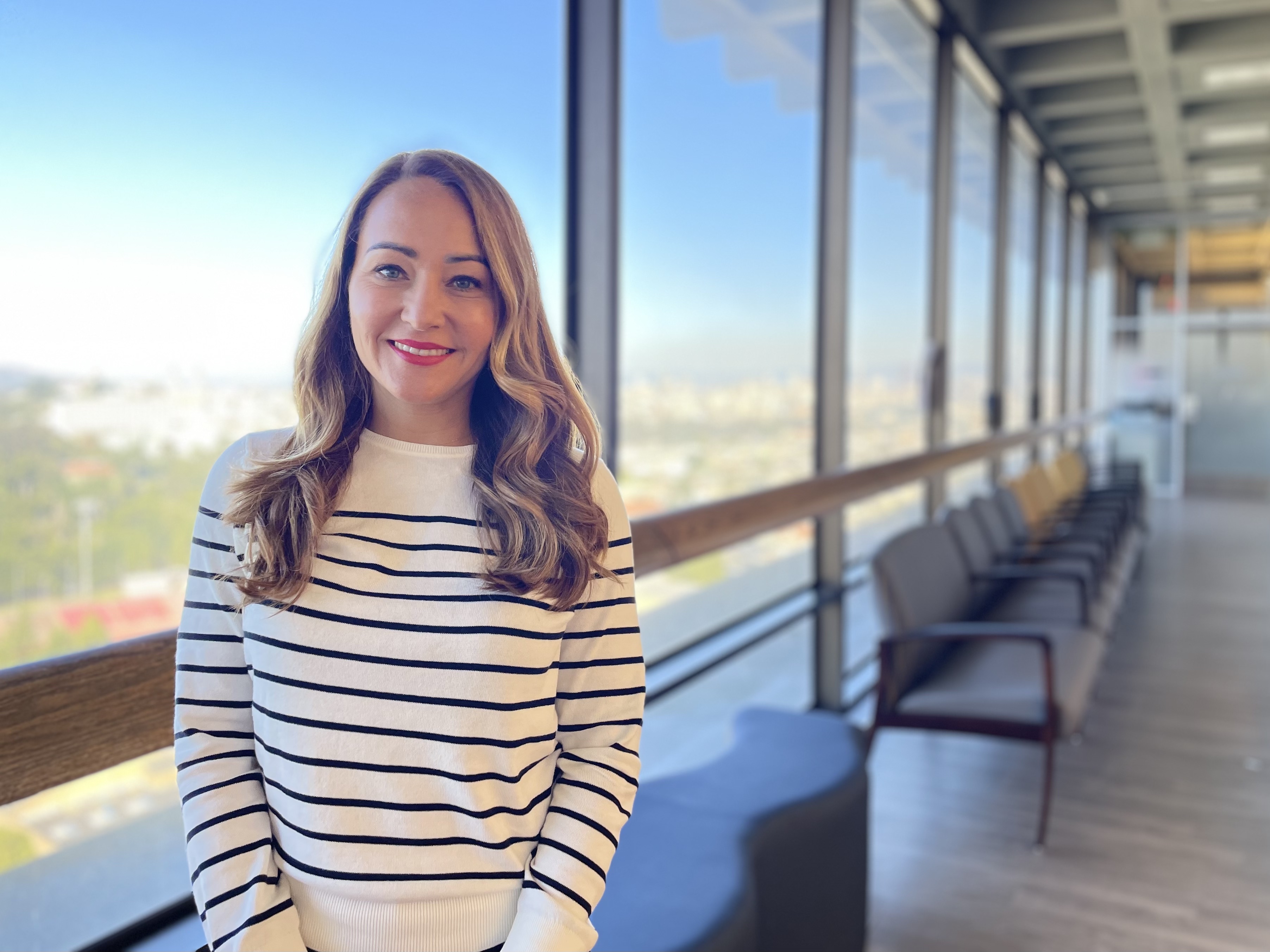 A woman in a striped shirt at UCSF medical offices at 400 Parnassus Ave.