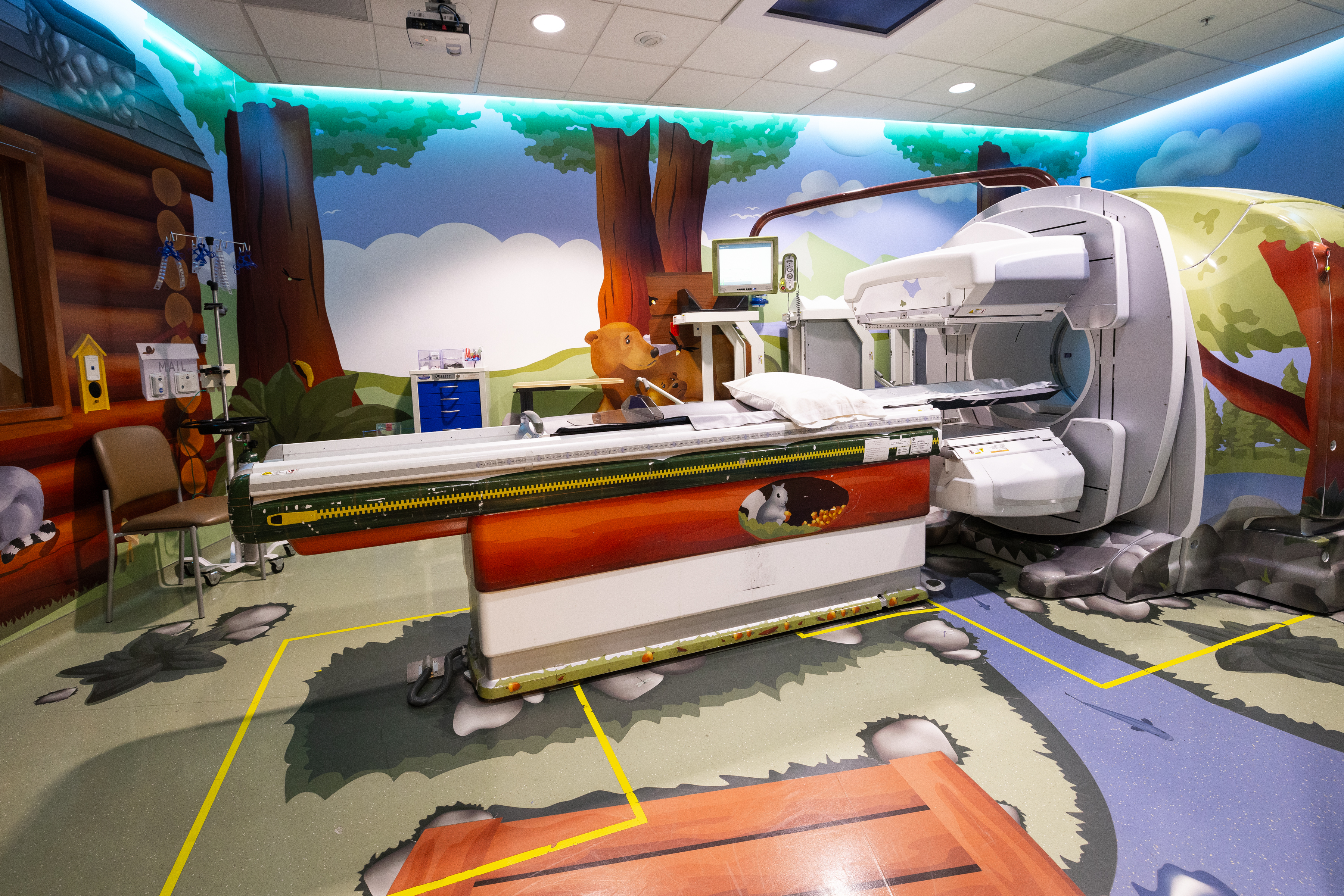 UCSF Benioff Children’s Hospital SpectCT scanner, one of four Adventure Series themed-rooms at Mission Bay. In this "Muir Woods" room, patients can lie down on sleeping bag (exam table), while the park ranger (technologist) completes their exam from the ranger station (control room).