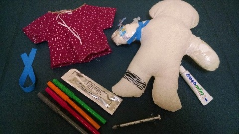 A doll and materials radiology nurses and Child Life specialists typically use in medical play to help prepare kids for an IV placement. A doll and materials radiology nurses and Child Life specialists typically use in medical play to help prepare kids for an IV placement.