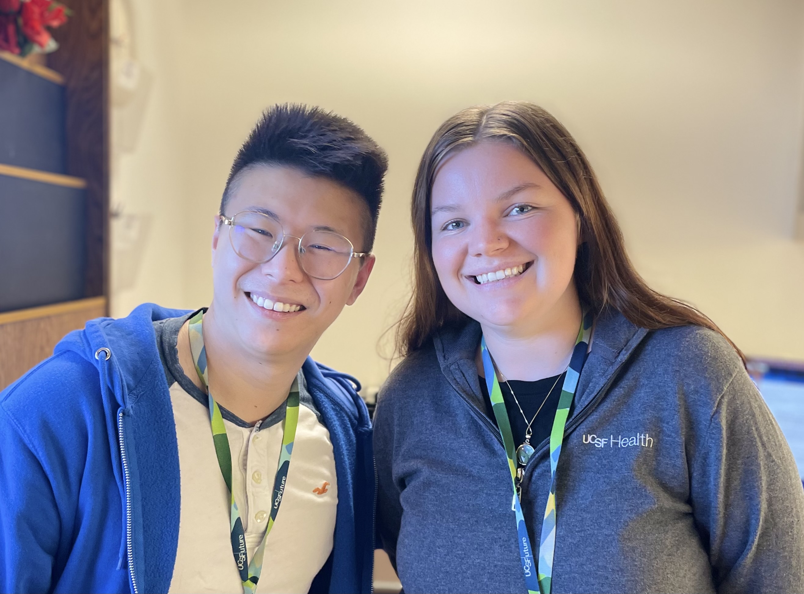 Jesse Huang, Practice Coordinator, with colleague Shannon Bogue at Parnassus Heights. Man and woman together smiling.
