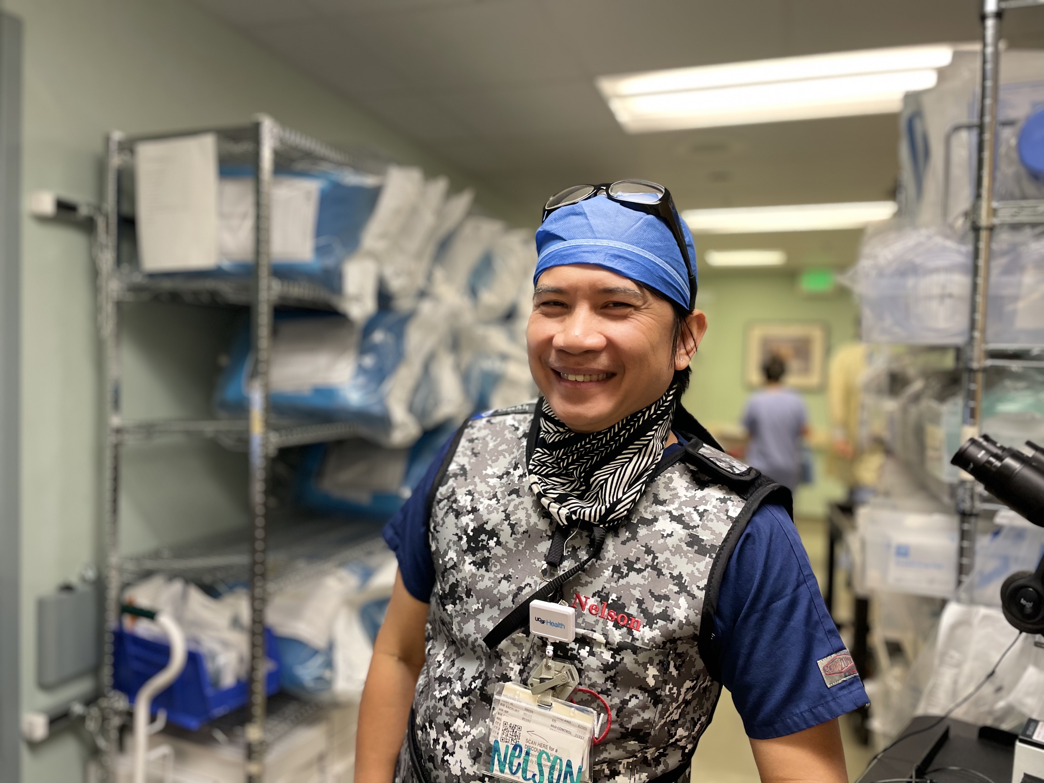Nelson Mercado, Clinical Nurse 2, at UCSF Helen Diller Medical Center at Parnassus Heights. A man in nursing scrubs smiling at UCSF Medical Center.