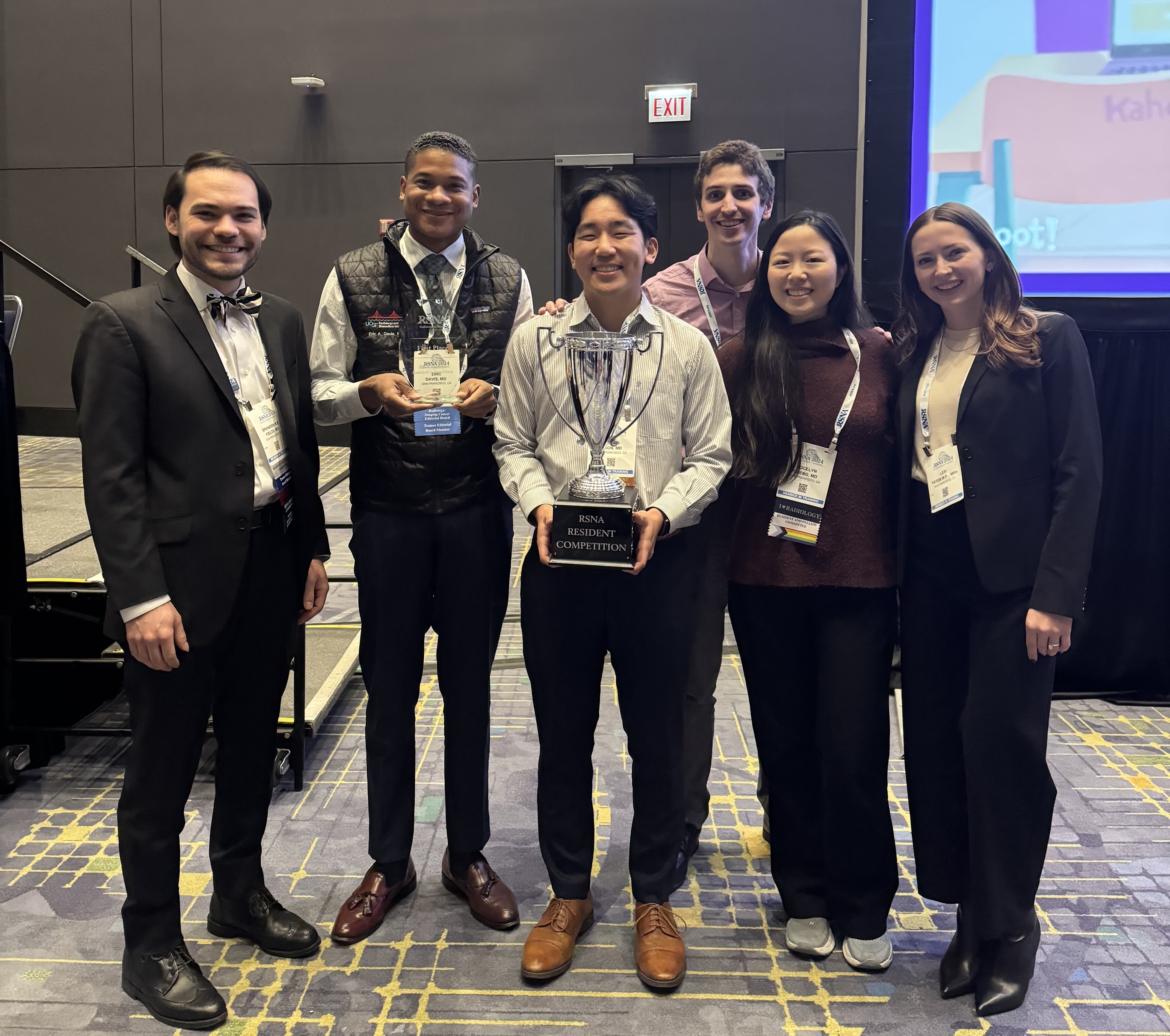 Brandon Fields, Eric Davis, Justin Yoon, Stephen Wahlig, Jocelyn Cheng, Lexi Tatem Five people holding a trophy