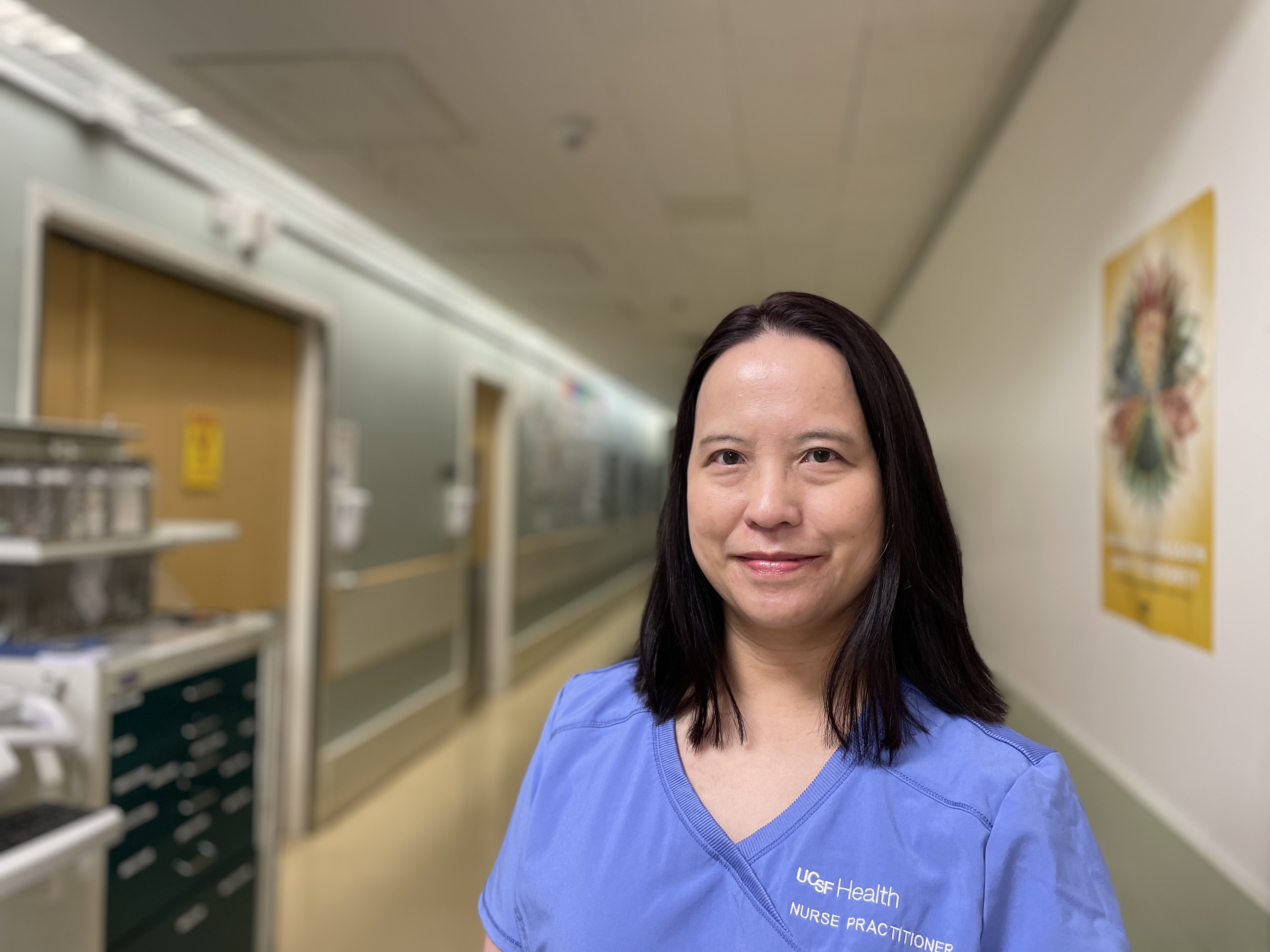 A woman standing in the hallway in the Interventional Radiology Department at UCSF Medical Center.