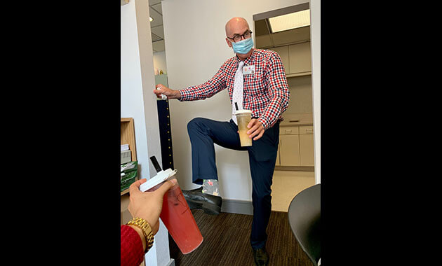 Chris Laubenthal, chief administrative officer wearing his special boba socks and necktie