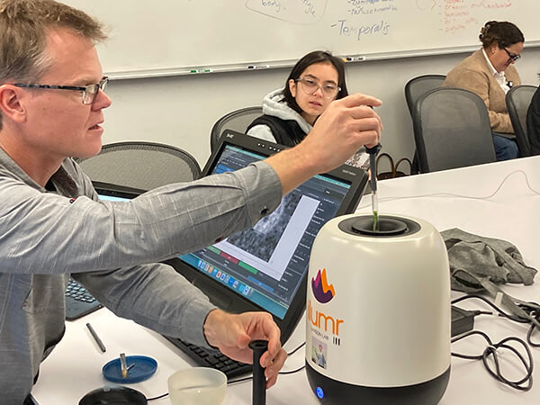 Peder Larson, PhD, demonstrates the tabletop MRI scanner to MSBI students Peder Larson, PhD, demonstrates the tabletop MRI scanner to MSBI students