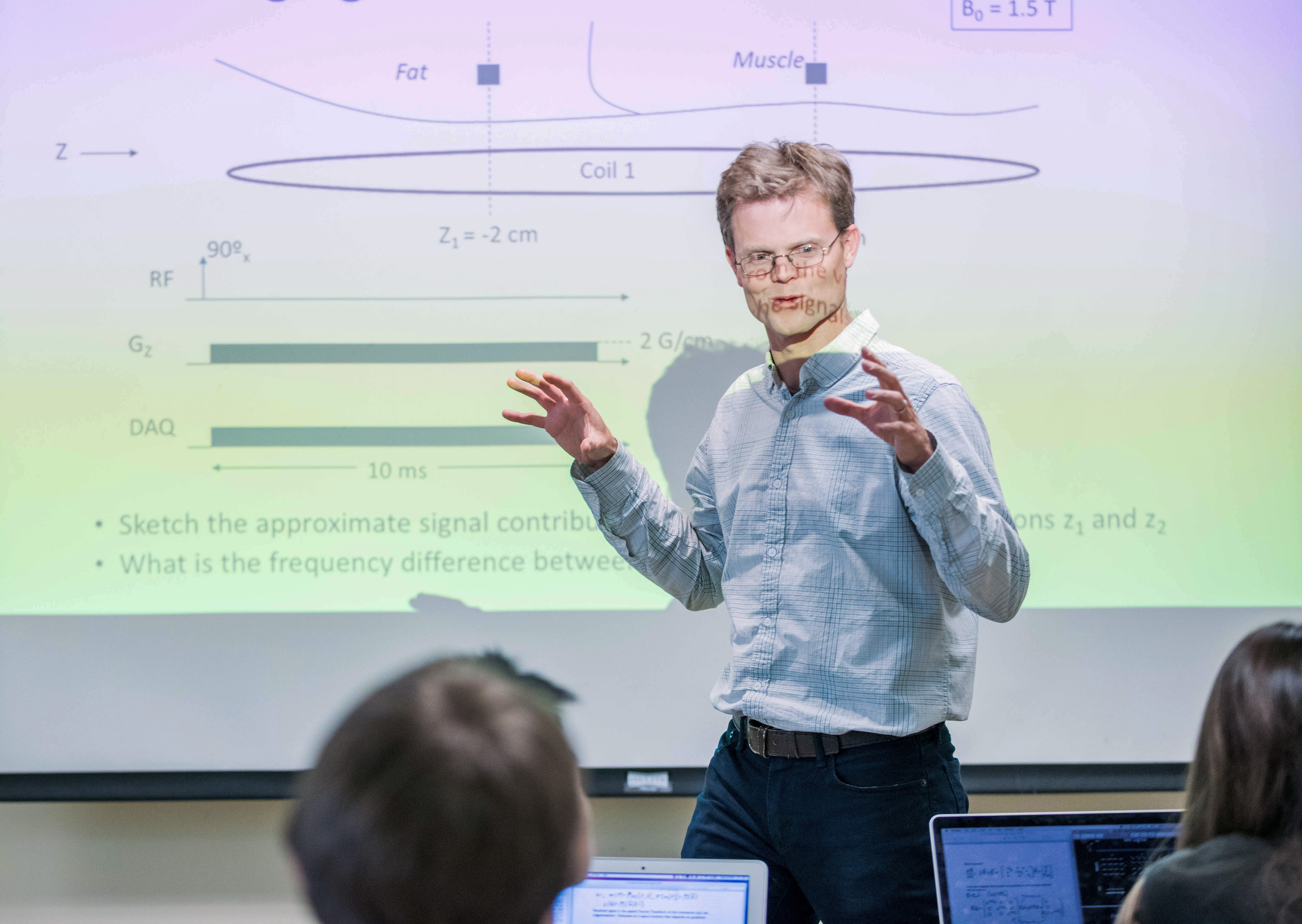 Dr. Larson talking to a classroom of students