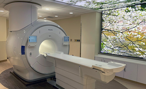 Our interventional magnet is a Philips Ambition 1.5T.  It features a 70cm bore, 45mT/m (peak) and 200mT/m/ms (slew) gradients, and a sealed magnet design that assures there will be no helium expulsion.