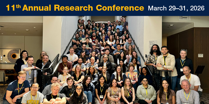Large group photo of UCSF Radiology researchers on a hotel staircase with a banner reading 11th Annual Research Conference, March 29–31, 2026