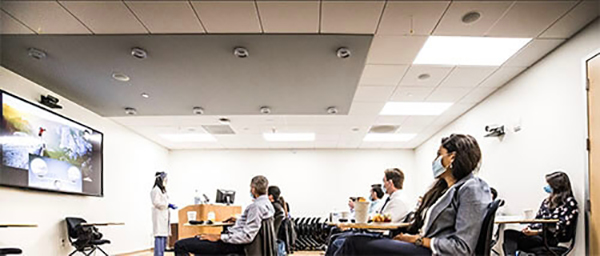 Image of Dr. Soonmee Cha teaching UCSF Radiology residents. The program was recently named a top-ranked program by Doximity.