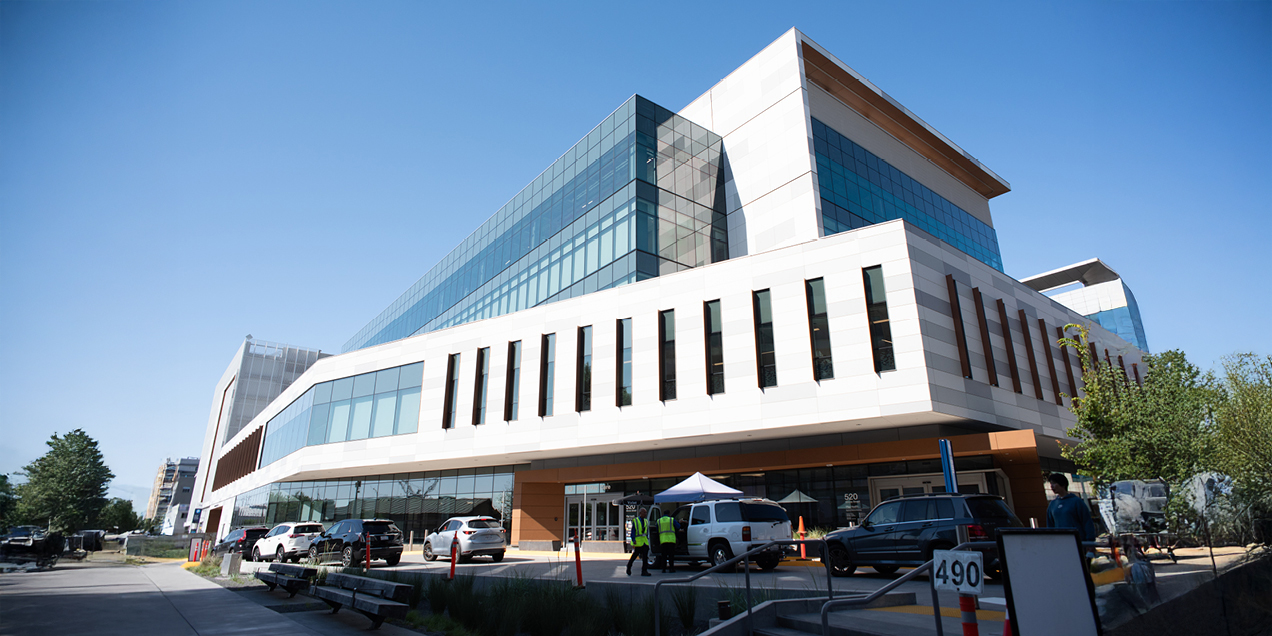 Exterior view of the UCSF Bayfront Medical Building at 520 Illinois Street in San Francisco, showing a modern glass and metal facade.