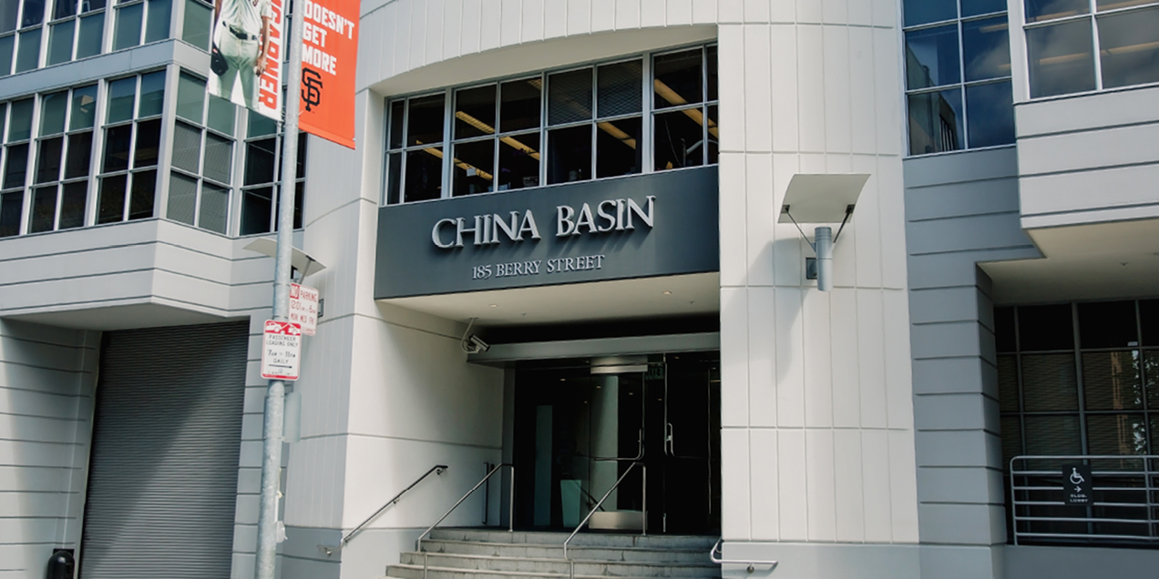 Exterior entrance of the China Basin building at 185 Berry Street in San Francisco, showing the main doorway and building signage.