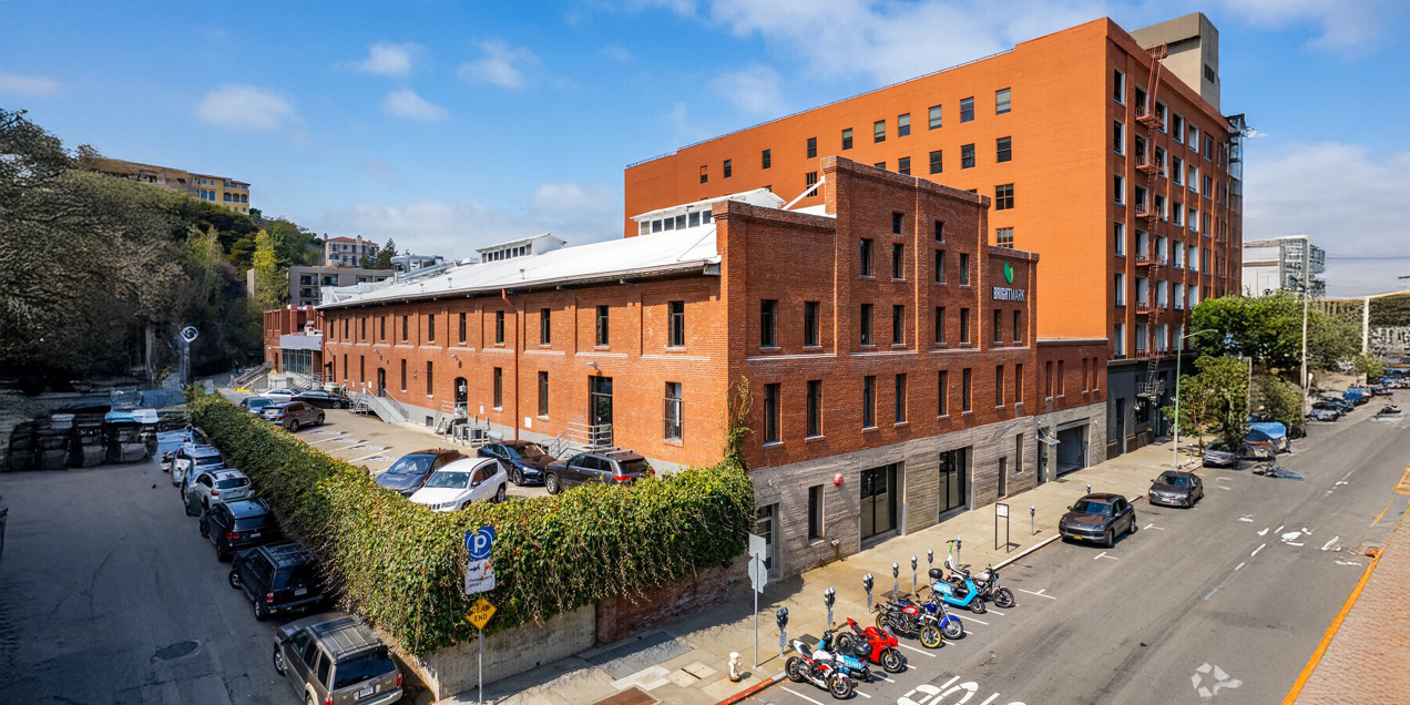 Exterior view of the Havas Building at 1725 Montgomery Street in San Francisco, showing the brick facade and surrounding street.