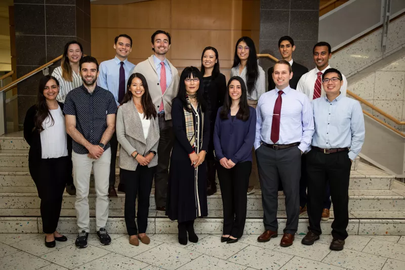 Fourteen people on a staricase