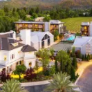 Front drive of the Alila resort at dusk with modern buildings and landscaped grounds