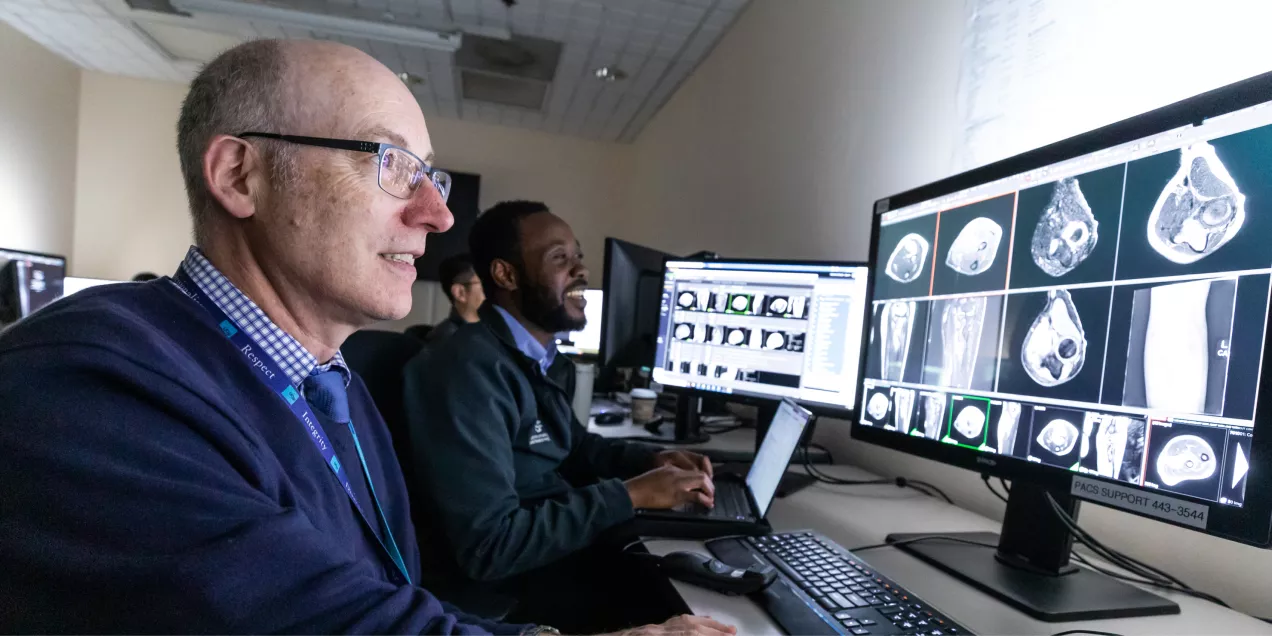 Radiologist reading scans in a reading room
