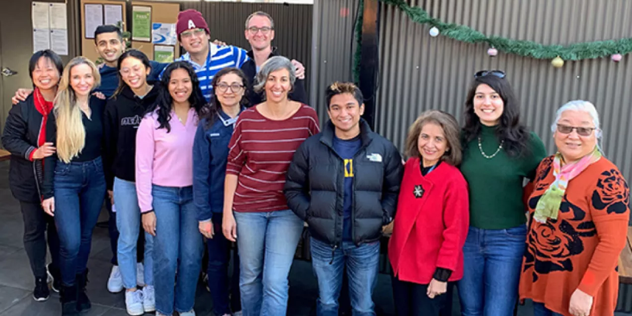 Bone Quality Research Lab members seated together at a restaurant during a social gathering.