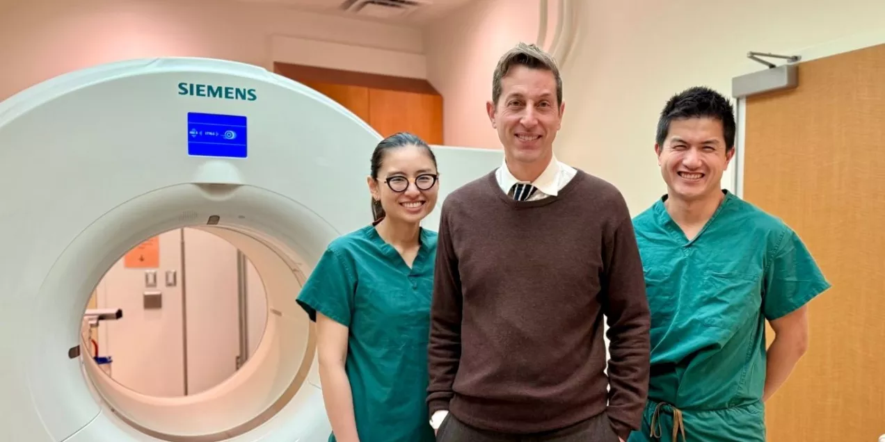 Radiologists in exam room smiling 