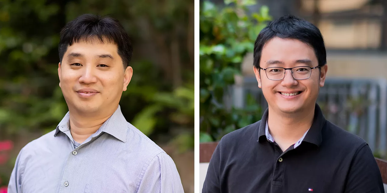 Clinician and researcher discussing medical imaging results at workstation with brain scan displayed on monitor