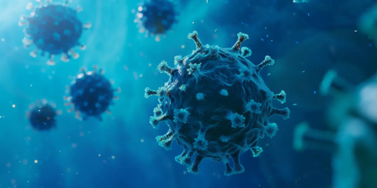 Digital illustration of coronavirus-like particles floating in a blue microscopic environment, with a large spiked viral particle in sharp focus at the center and several blurred particles in the background.