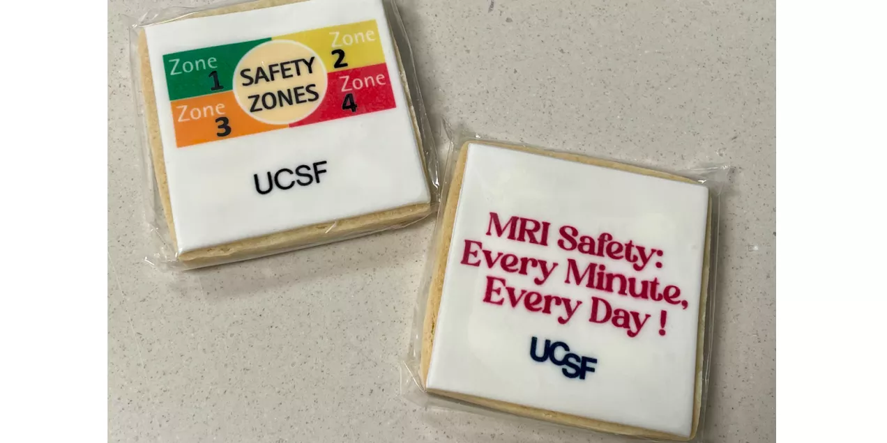 Two individually wrapped UCSF MRI Safety Week cookies, one featuring the four MRI safety zones and one reading “MRI Safety: Every Minute, Every Day!”