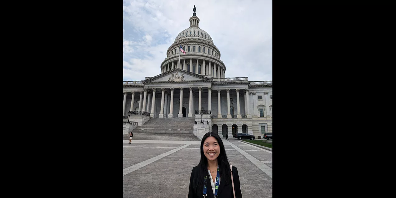 Connie Lu standing in front of the Capital