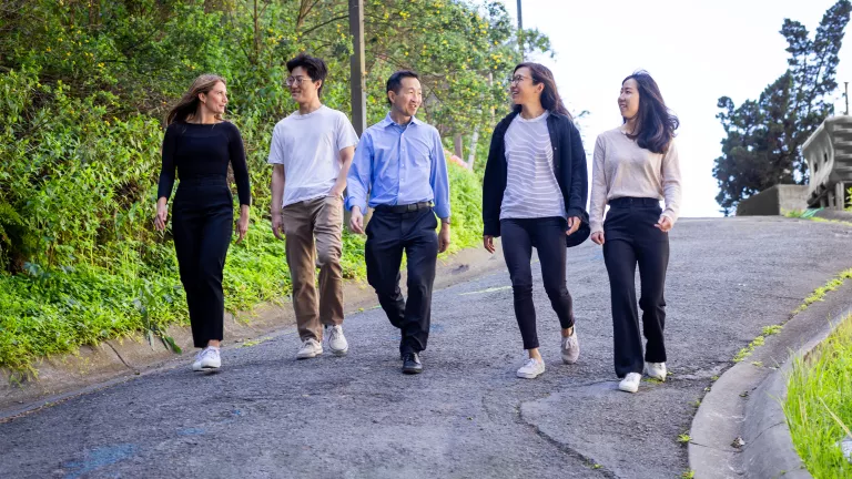 students walking with professor