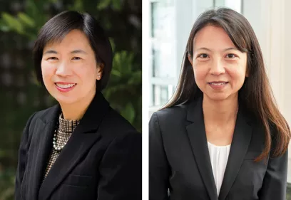 Side-by-side professional portraits of two women. On the left, a woman with short dark hair wears a black blazer, patterned blouse, and pearl necklace, smiling outdoors with blurred greenery in the background. On the right, a woman with long dark hair wears a black blazer over a white blouse and smiles at the camera in a softly lit indoor setting with windows in the background.
