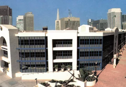 Exterior view of the UCSF China Basin building with the San Francisco skyline in the background.