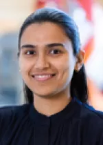 Professional headshot of a woman smiling, photographed indoors