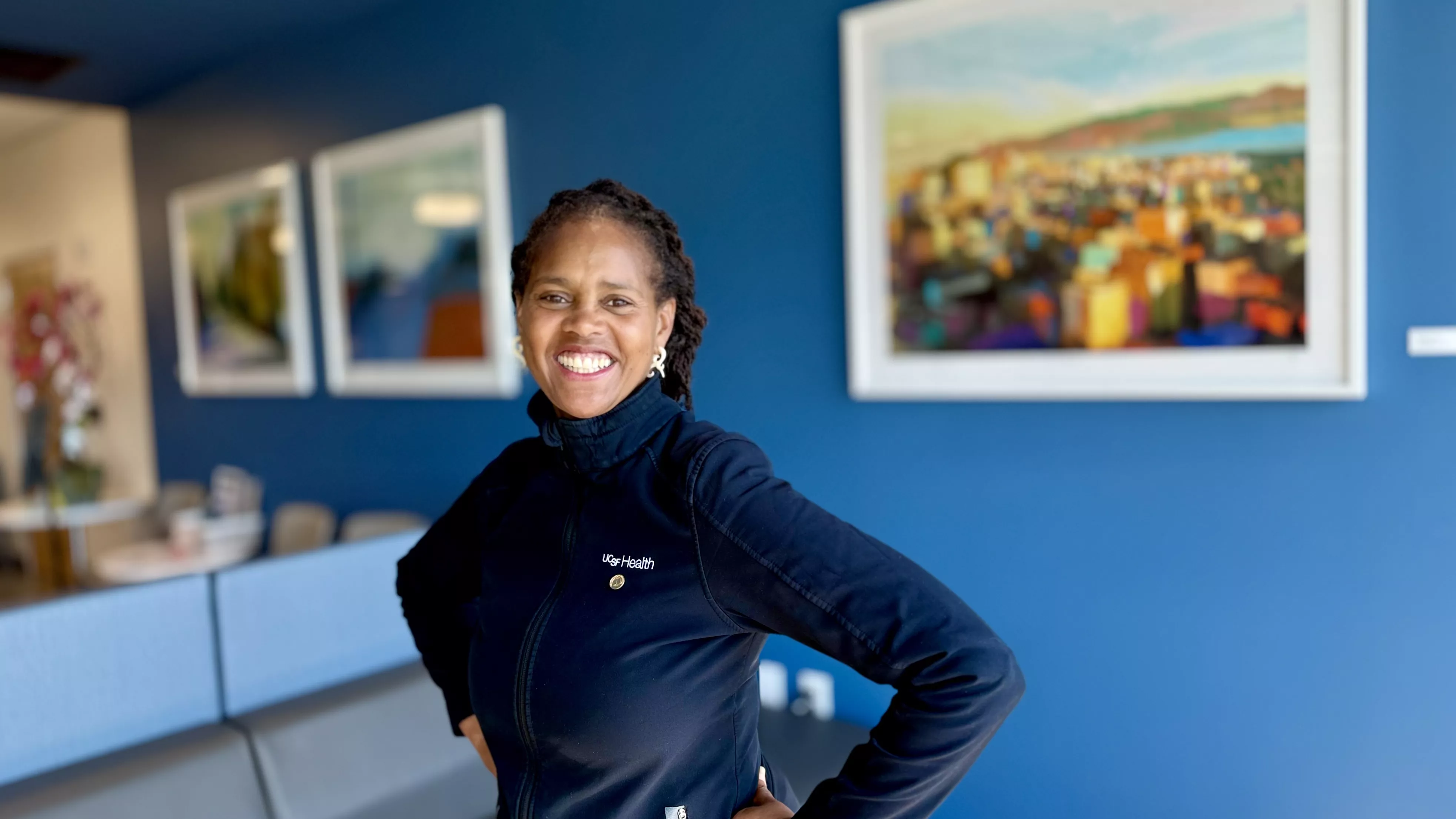 Erika in front of a blue wall