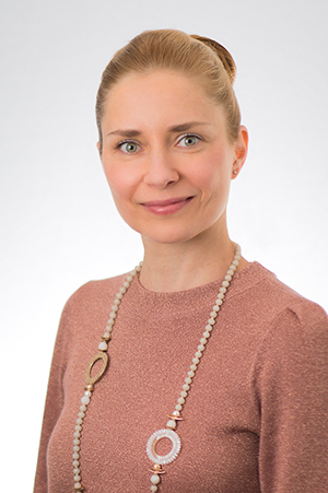 Headshot of UCSF Radiology faculty member Olga Tymofiyeva, PhD - woman wearing a light colored against a light colored background