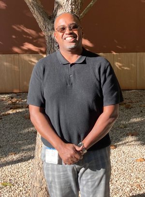 Man in black shirt and sunglasses