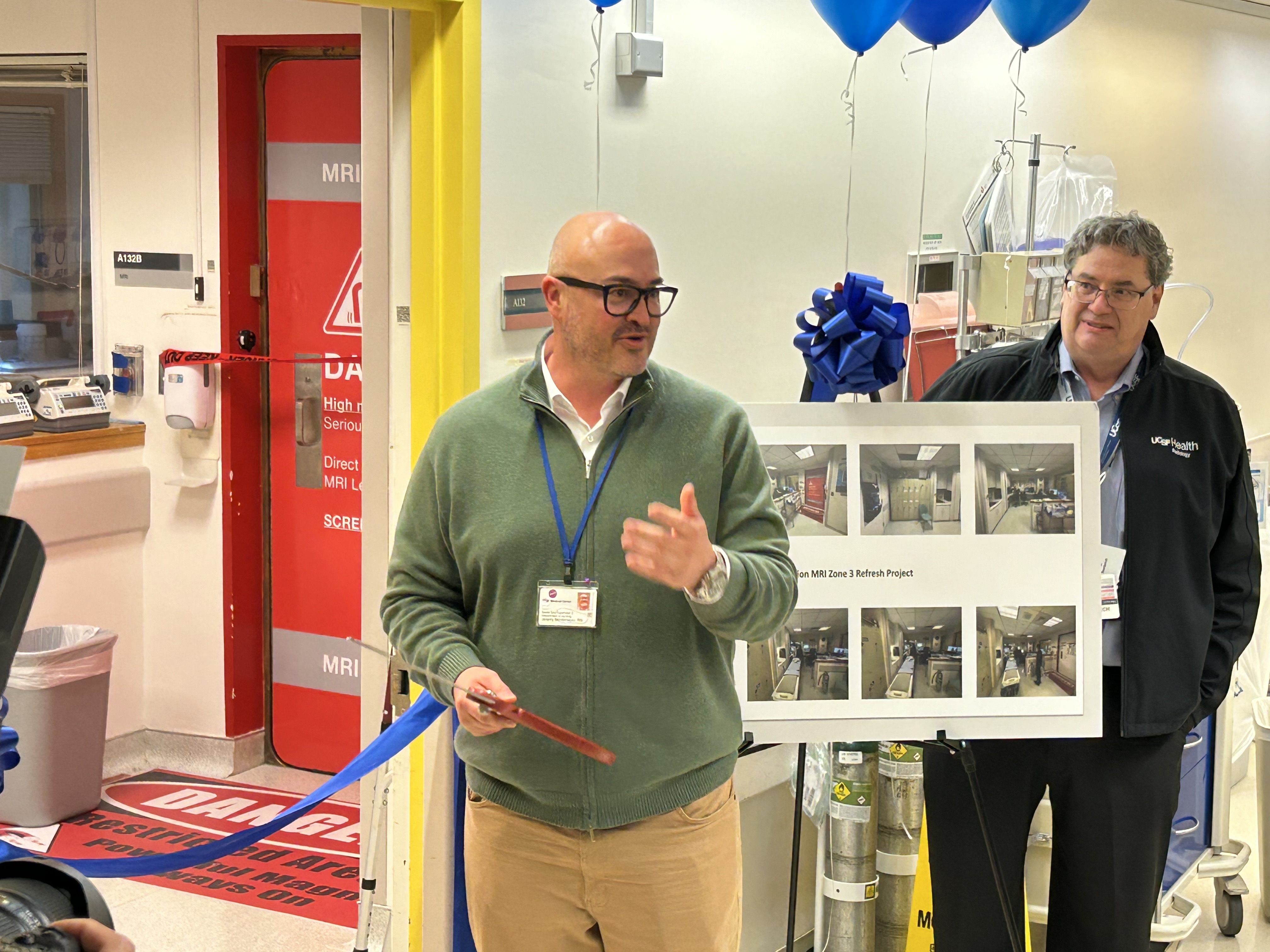 Jeremy Montemayor cutting blue ribbon