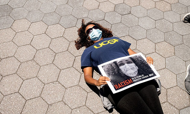 Tatiana Kelil, MD, participating in a die-in at the CNA-organized protest for healthcare workers at UCSF Mission Bay on June 13, 2020.