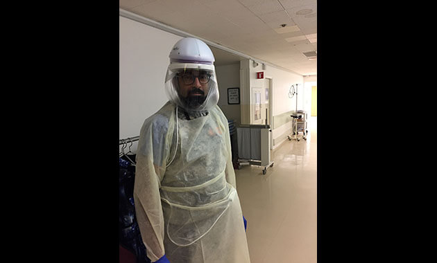 Pallav Kolli, MD. Photo from early March, before masks were required and PPE was in short supply.