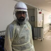 Pallav Kolli, MD. Photo from early March, before masks were required and PPE was in short supply.